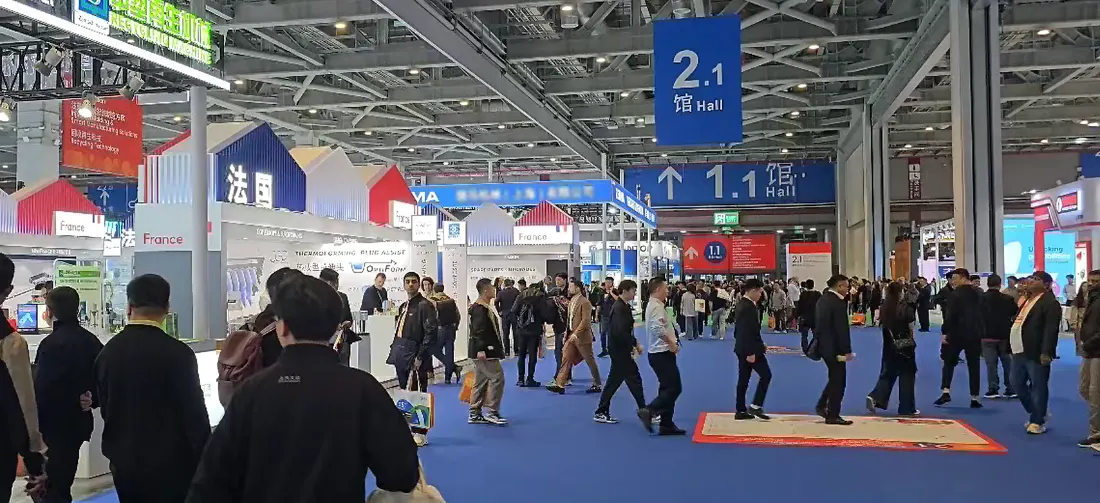 Interior aisle landscape of Hall 2.1 during Chinaplas 2026 global plastics industry exhibition