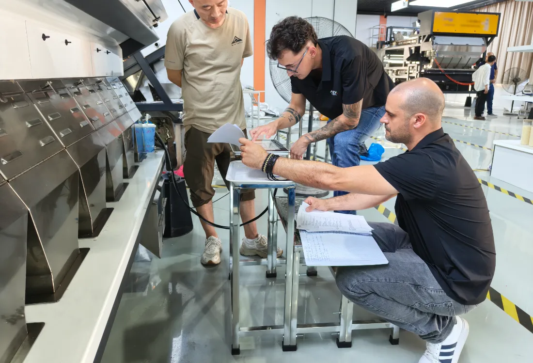 Spanish distributor takes notes and practices machine operation under the guidance of APEX senior engineers