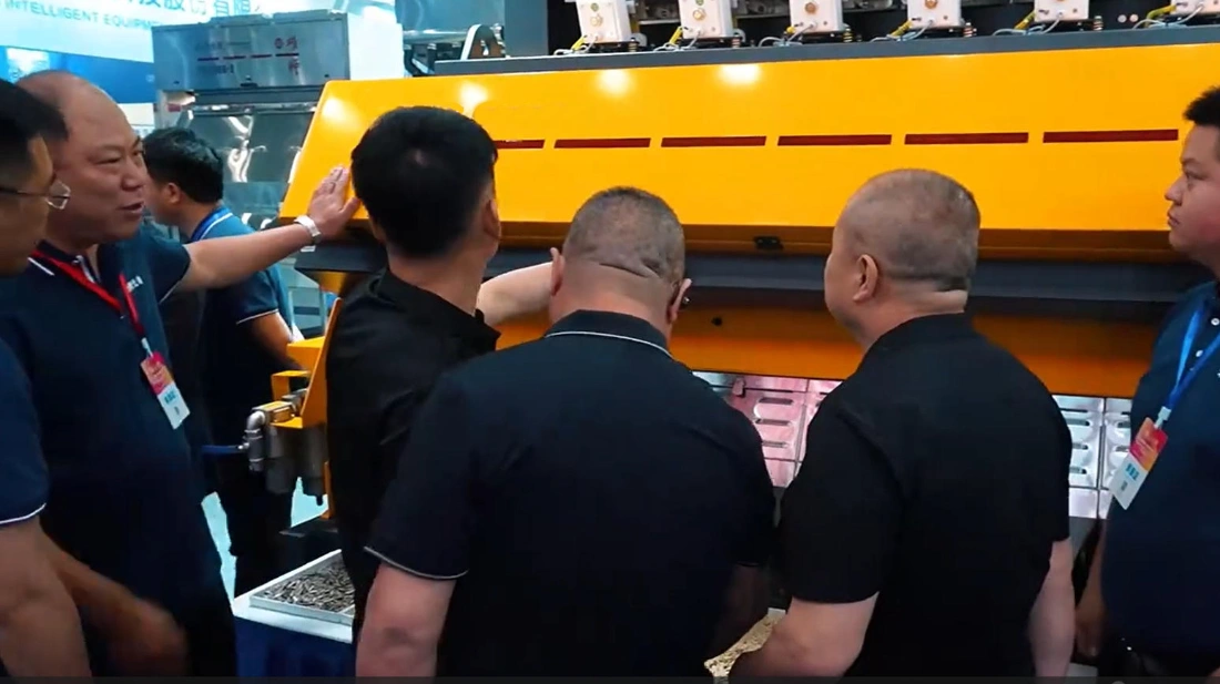 visiting buyers are discussing the sorting machine details with APEX Sorting staff